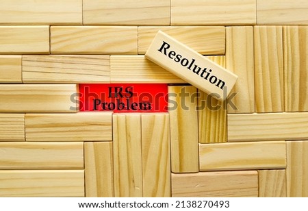 Business Concept - IRS Problem Resolution text in red on wooden blocks 