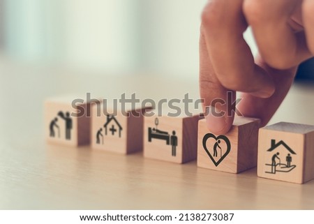 Elderly care concept. Holding wooden cube smart flat design with icon related to elderly care, medical, rehabilitation service, nursing care for enhancing quality of life in elder age. Care banner.
 Royalty-Free Stock Photo #2138273087