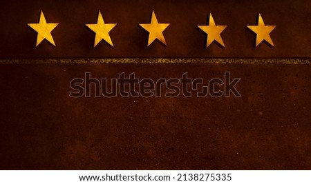 golden Board or signboard for a five stars hotel. 5 stars hotel signage board. Wall of a building with a sign for a hotel with star declaration