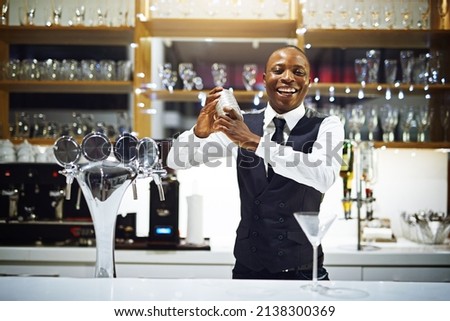 Its time to shake things up in here. Cropped shot of a well-dressed bartender standing behind the counter. Royalty-Free Stock Photo #2138300369