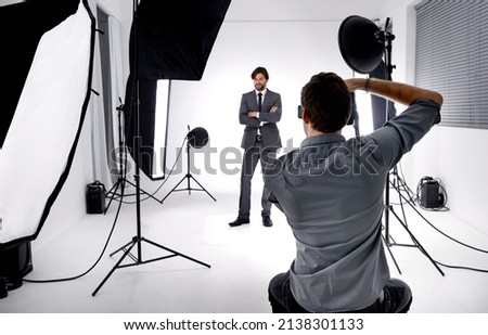 Photo craft. Shot of a photographer working in his studio. Royalty-Free Stock Photo #2138301133
