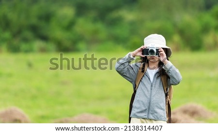 Asian girl woman take a photo and checking camera. People tourism travel destination leisure trips for education relax outdoors adventure forest nature. Travel vacations Concept
