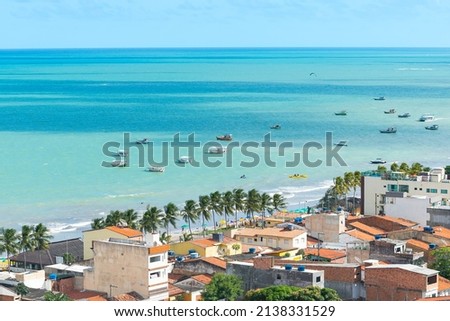 Aerial view of Maragogi, AL, Brazil. Landscape of the city and the Maragogi beach, famous tourist destination of the brazilian coast. Royalty-Free Stock Photo #2138331529