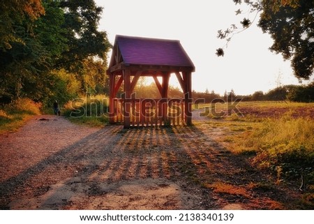 Sunset was coming down nicely behind this mini hut outside the woods Royalty-Free Stock Photo #2138340139