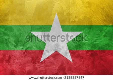 Textured photo of the flag of Myanmar.