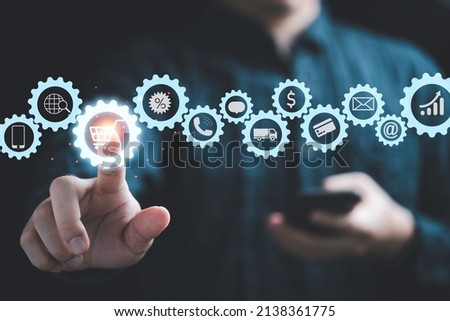 Businessman touching to virtual info graphics with trolley cart icons , Technology online shopping business concept. Royalty-Free Stock Photo #2138361775