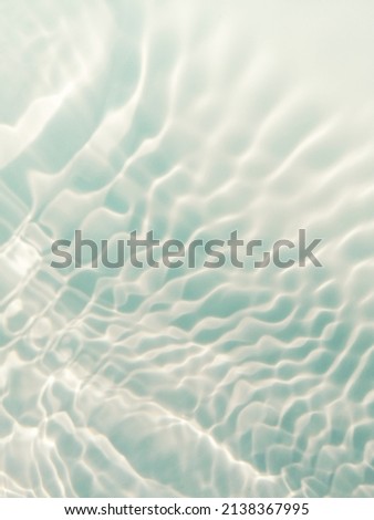 Closeup​ blur​ed​ abstract​ of​ surface​ blue​ water. Abstract​ of​ surface​ blue​ water​ reflected​ with​ sunlight​ for​ background. Blue​ sea. Blue​ water.​ Water​ splashed​ use​ for background.