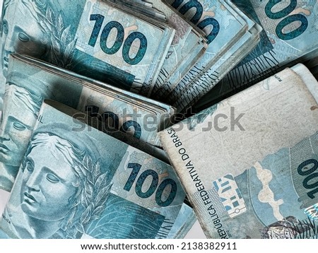 Pile of Brazilian cash of hundred reais with soft focus Royalty-Free Stock Photo #2138382911