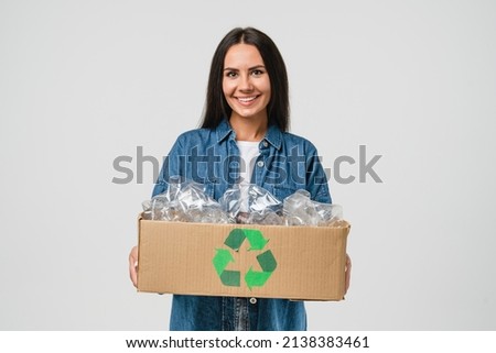Young friendly eco-activist woman girl sorting garbage, holding carton box full of plastic bottles for preserving saving environment nature protection, plastic resycling isolated in white