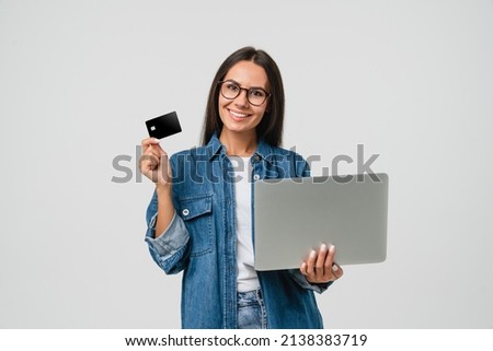 Smart caucasian young woman student freelancer bank client customer using credit card for online payment shopping transactions cashback loan on laptop isolated in white background Royalty-Free Stock Photo #2138383719