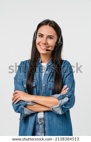 Vertical portrait of young friendly caucasian woman IT support customer support agent hotline helpline worker in headset looking at camera while assisting customer client isolated in white background Royalty-Free Stock Photo #2138384513