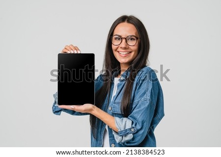 E-learning e-banking. Smart caucasian young woman holding showing digital tablet blank screen for mockup copy space with mobile application for advert isolated in white background