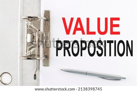 VALUE PROPOSITION text on paper folder with pen. Business concept
