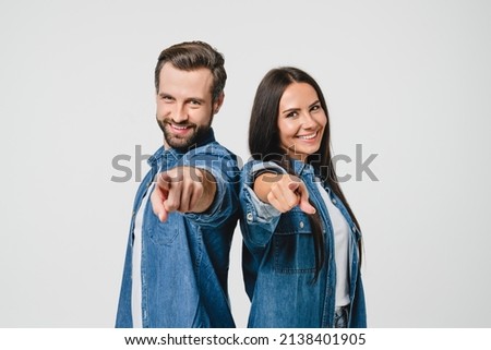 Caucasian young spouses couple pointing at camera, choosing you for new opportunities, challenge, selecting winner isolated in white background