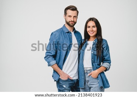 Loving caucasian couple young spouses boyfriend and girlfriend hugging embracing together, sharing passion on romantic date looking at camera isolated in white background Royalty-Free Stock Photo #2138401923