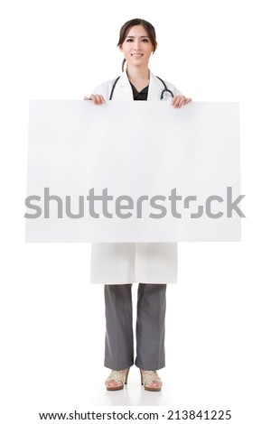 Asian doctor woman holding blank board, full length portrait isolated on white background.