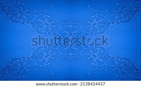Blue lace fabric. seamless texture. You'll be the star of the show with this floral print lace insert! This panel features a raised floral pattern interspersed with larger, brighter blue flowers.