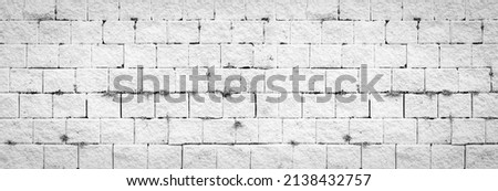 Abstract white brick wall texture light gray old stucco and vintage brickwork pattern background in home interior, grunge rusty blocks of stonework grey color panoramic wide bacground wallpaper