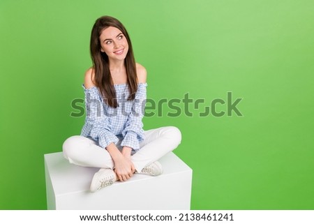 Photo of cute sweet positive female look blank space see product advert sale discount isolated on green color background