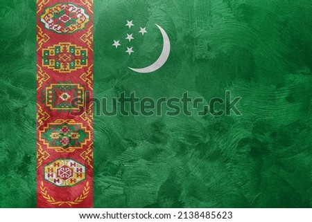 Textured photo of the flag of Turkmenistan.