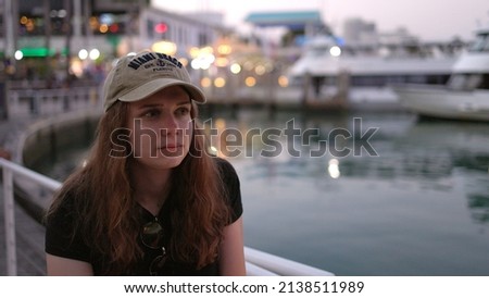 Young woman at Miami Bayside - close up shot in the evening