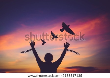 Silhouette man with chain Freedom, Worship and Pray.Repent of wrong doing.Prisoner with break chain power of prayer sunset background.Pray faith hope.Forgive revival.Sacrifice and Mercy.Man repent sin Royalty-Free Stock Photo #2138517135