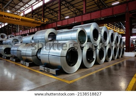 Rolls of galvanized steel sheet inside the factory or warehouse. Royalty-Free Stock Photo #2138518827