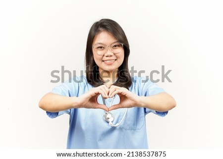 Showing Love Sign Of Asian Young Doctor Isolated On White Background