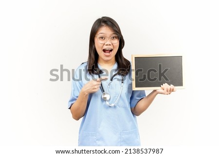 Showing Presenting and holding Blank Blackboard Of Asian Young Doctor Isolated On White Background