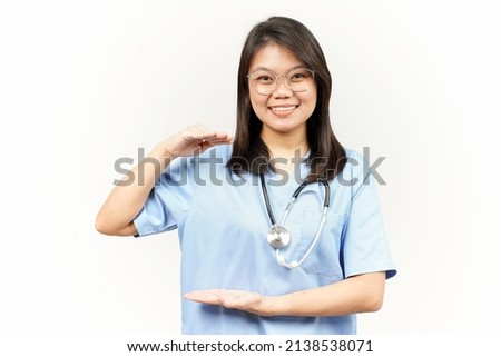 Measuring and Showing Big Sign Product Of Asian Young Doctor Isolated On White Background