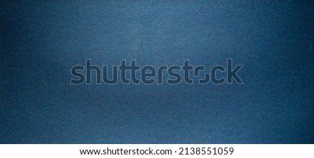 Photo of a metallic blue texture. Chrome dark blue background.
