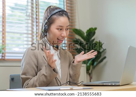 Operator, smile asian young woman wearing headset, headphones and speaking on video call conference with customer, colleagues support phone, work on laptop computer
Technology of help, consult service