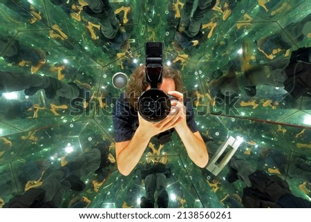 Portrait of a photographer inside a kaleidoscope room