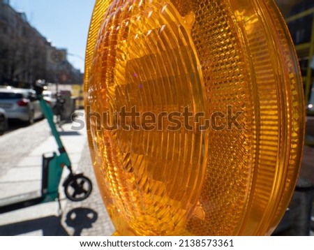 Yellow signal lamp. Road repair. Warning signal at the construction site