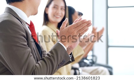 Close up shot of happy business employees professional officer team clapping hands with praise to support ideas planing sitting in meeting room cooperating together in creative negotiations concept