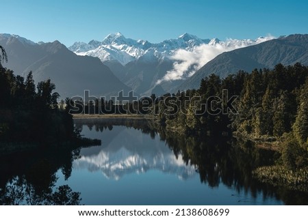 Reflection of the mountains in Lake Matheson. New Zealand landscape, West Coast.