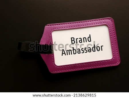 Purple ID card holder with text BRAND AMBASSADOR, refer to person employed by organization or business owner to represent brand in positive image to increase brand awareness