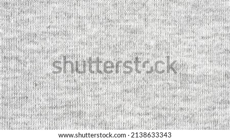 Close up gray cotton heather texture background.  
Black and white texture knit fabric pattern seamless.
Selective focus.
top view.