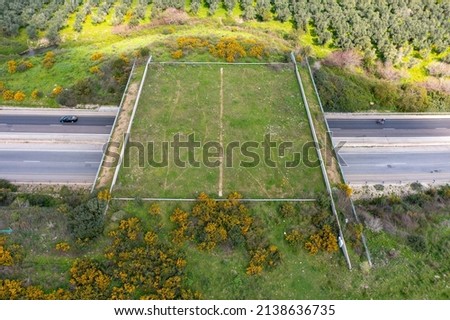 Wildlife crossing bridge allowing animals a safe passage over a rural Highway. Royalty-Free Stock Photo #2138636735