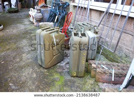Old petrol cans in a yard sale 