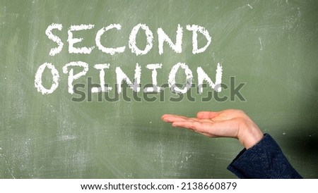 SECOND OPINION. Text on a green chalkboard. Woman points with hand.