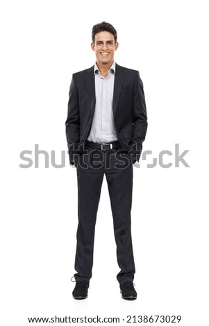 Hes a true professional. Full length portrait of a happy young businessman standing with his hands in his pockets. Royalty-Free Stock Photo #2138673029