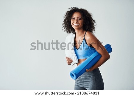 Happiness and healthiness is becoming the better version of yourself. Studio shot of an athletic young woman against a grey background. Royalty-Free Stock Photo #2138674811