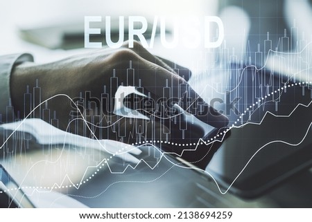 Creative concept of EURO USD financial chart illustration and finger clicks on a digital tablet on background. Trading and currency concept. Multiexposure