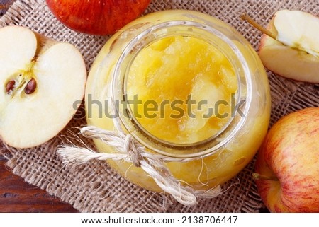 homemade apple sauce or apple puree in glass bowl over rustic wooden table. top view Royalty-Free Stock Photo #2138706447