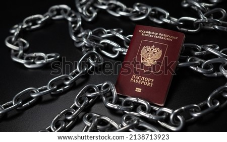 the passport of the Russian Federation against the background of chains as a symbol of restrictions and sanctions - translation - Russian federation, passport