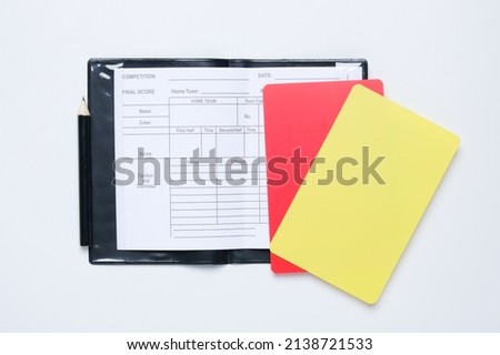 A picture of referee match equipment with red and yellow card insight. Follow the rules concept.