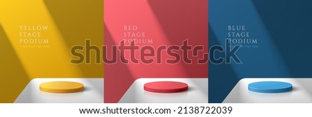 Set of yellow, dark blue and red realistic 3d cylinder pedestal podium on white table in abstract rooms. Vector rendering geometric forms. Colorful minimal scene. Stage for showcase, Product display.