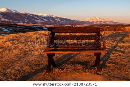 Bench at sunset. Krivan hill in the  background