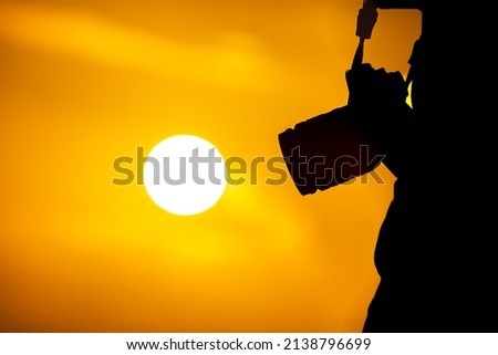 silhouette of a person with a backlit camera. Concept of tourism and vacations 